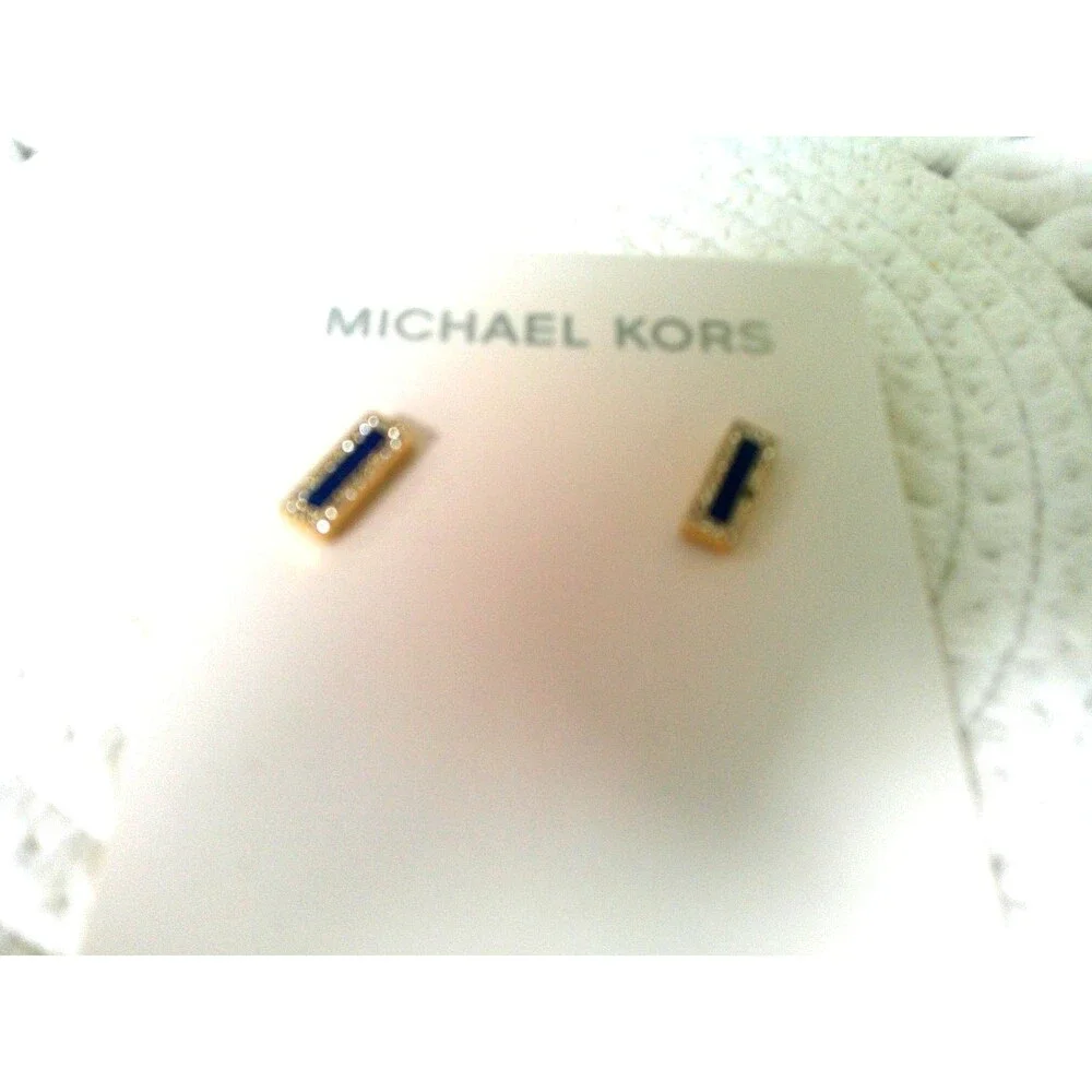 Michael Kors Sapphire and Diamond Earrings. One tiny stone missing. Retailed $85